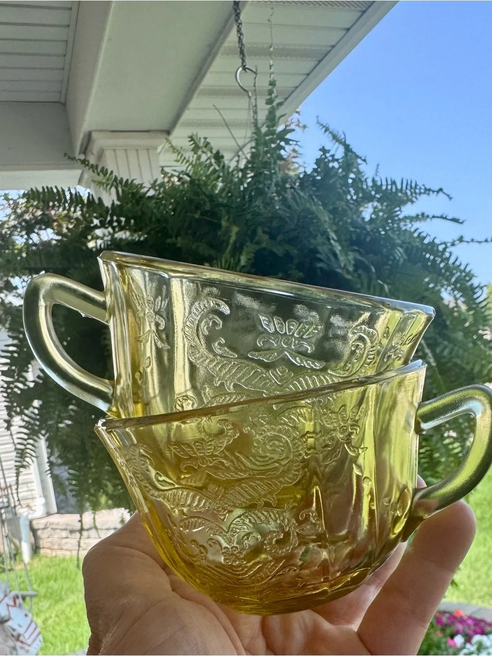 2 Vintage yellow depression glass tea cups.
